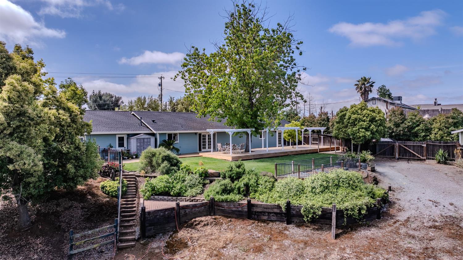6364 Baldwin Street Valley Springs, CA 95252 - Photo 66 of 72 a front view of a house with a yard and potted plants