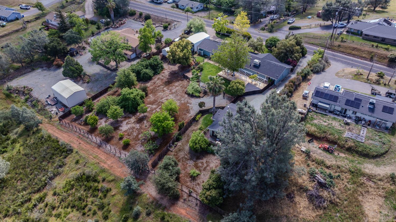 6364 Baldwin Street Valley Springs, CA 95252 - Photo 68 of 72 an aerial view of a house with a yard and a large tree