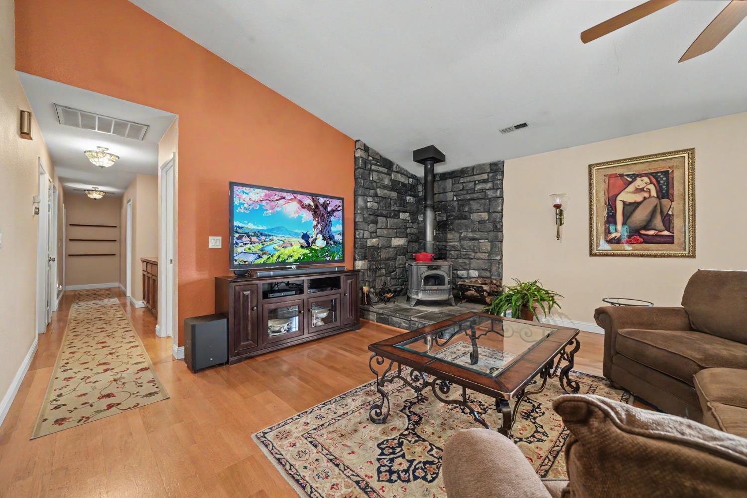 6364 Baldwin Street Valley Springs, CA 95252 - Photo 9 of 72 a living room with furniture and a flat screen tv