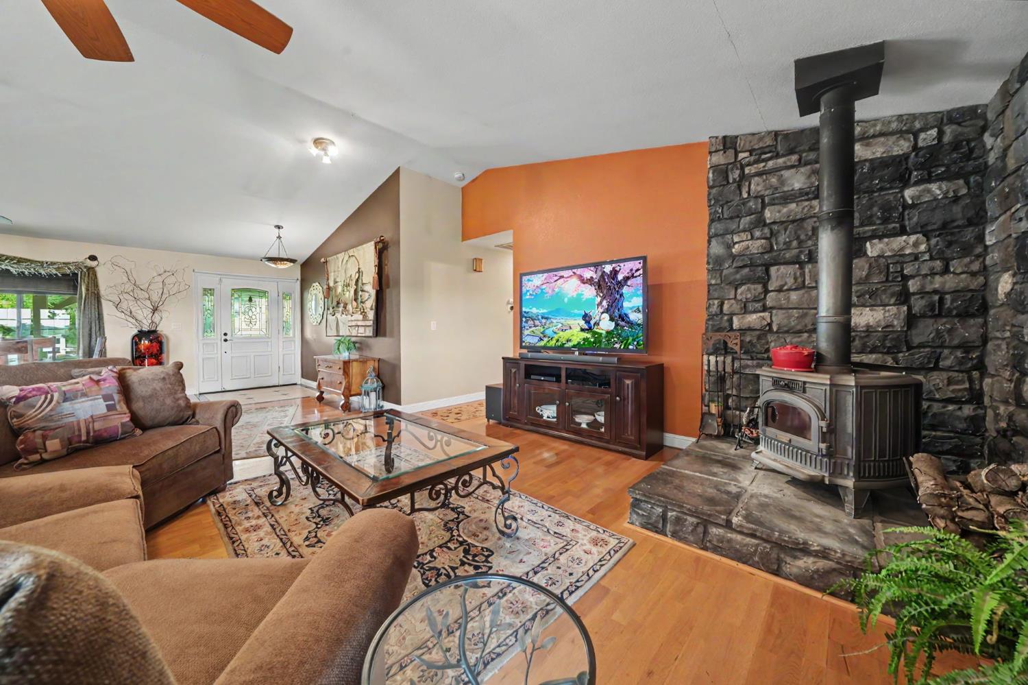 6364 Baldwin Street Valley Springs, CA 95252 - Photo 10 of 72 a living room with furniture and a flat screen tv