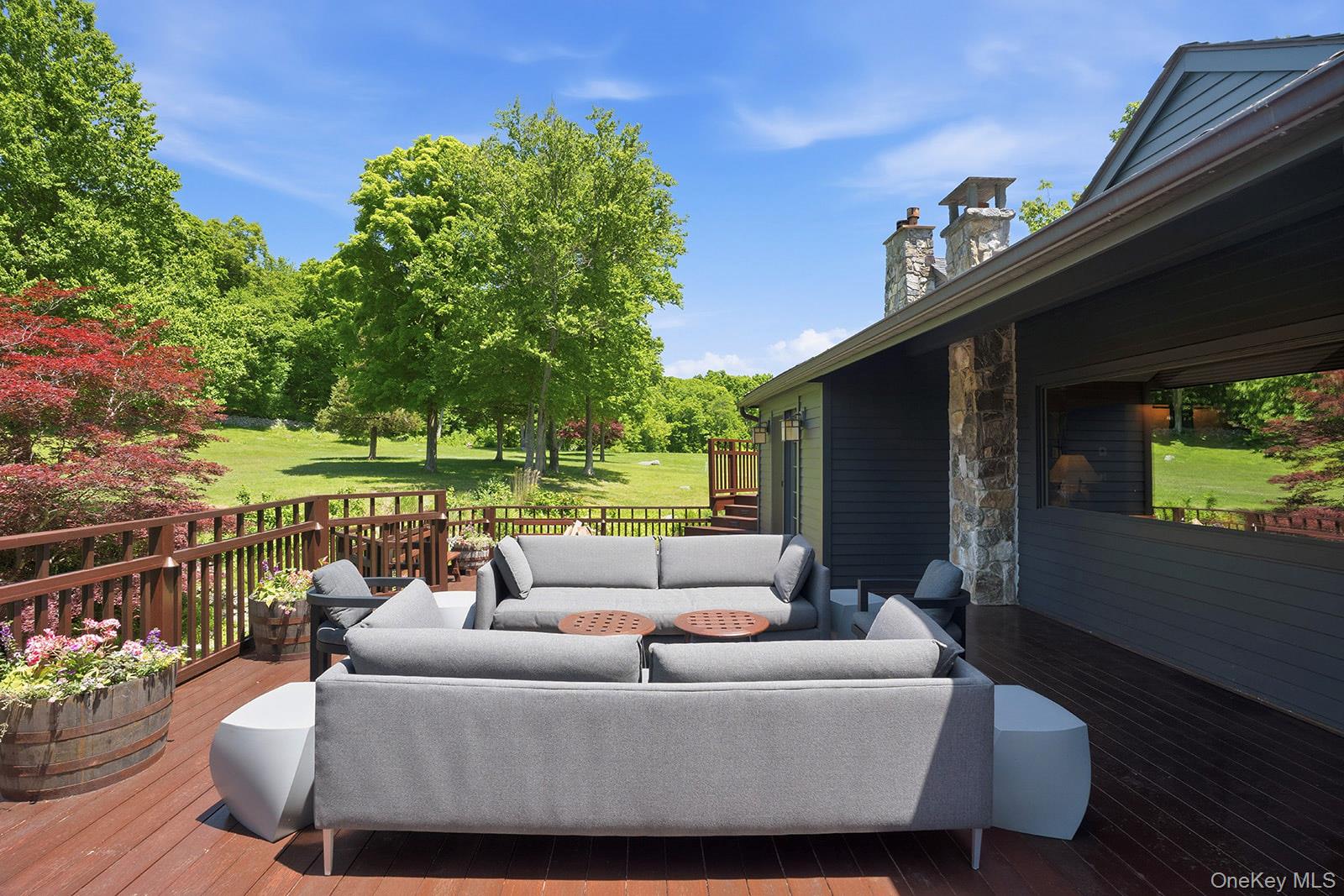 180 Dean Road Carmel, NY 10512 - Photo 26 of 50 Large deck off main floor of primary home with views of stream and pond