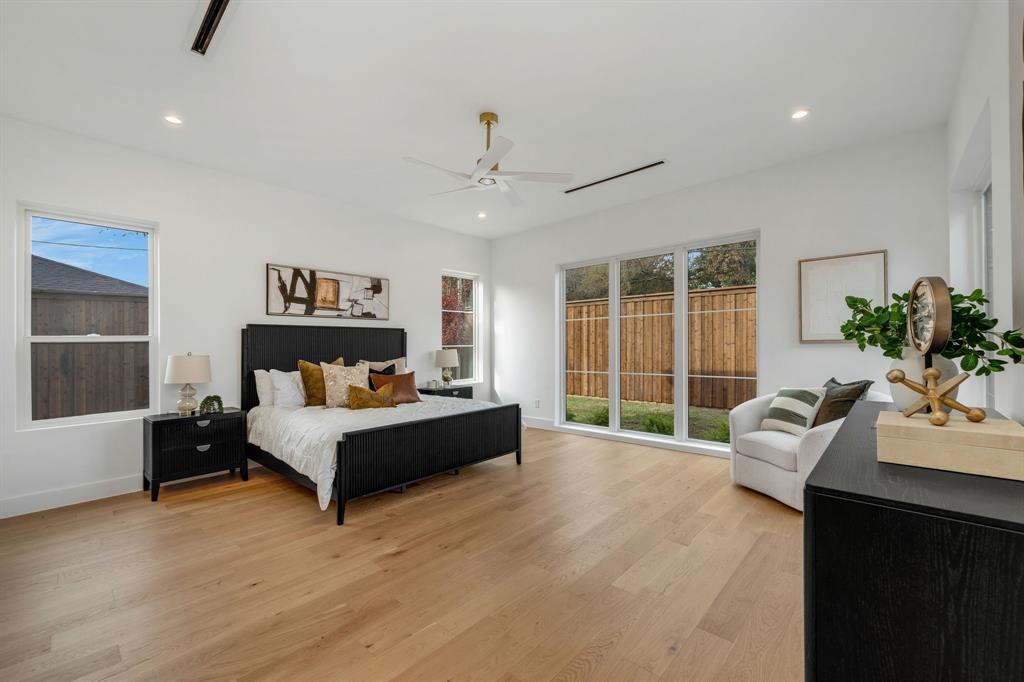 3627 Merrell Road Dallas, TX 75229 - Photo 16 of 39 a spacious bedroom with a bed and a couch