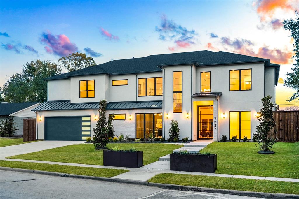 3627 Merrell Road Dallas, TX 75229 - Photo 2 of 39 a front view of a house with a yard and garage