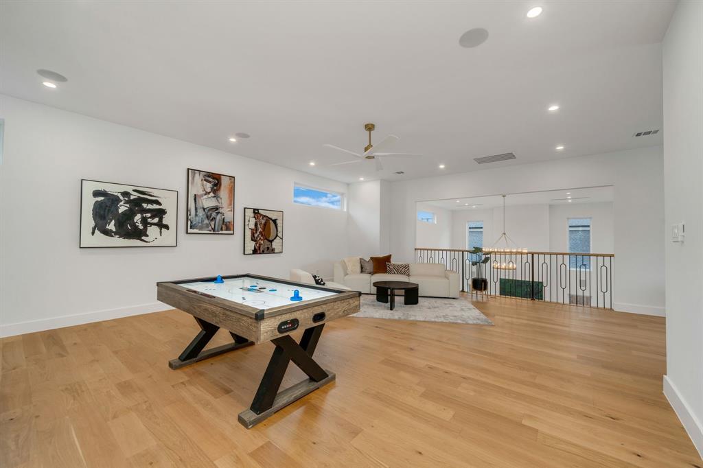 3627 Merrell Road Dallas, TX 75229 - Photo 23 of 39 a living room with dining table a table and kitchen view