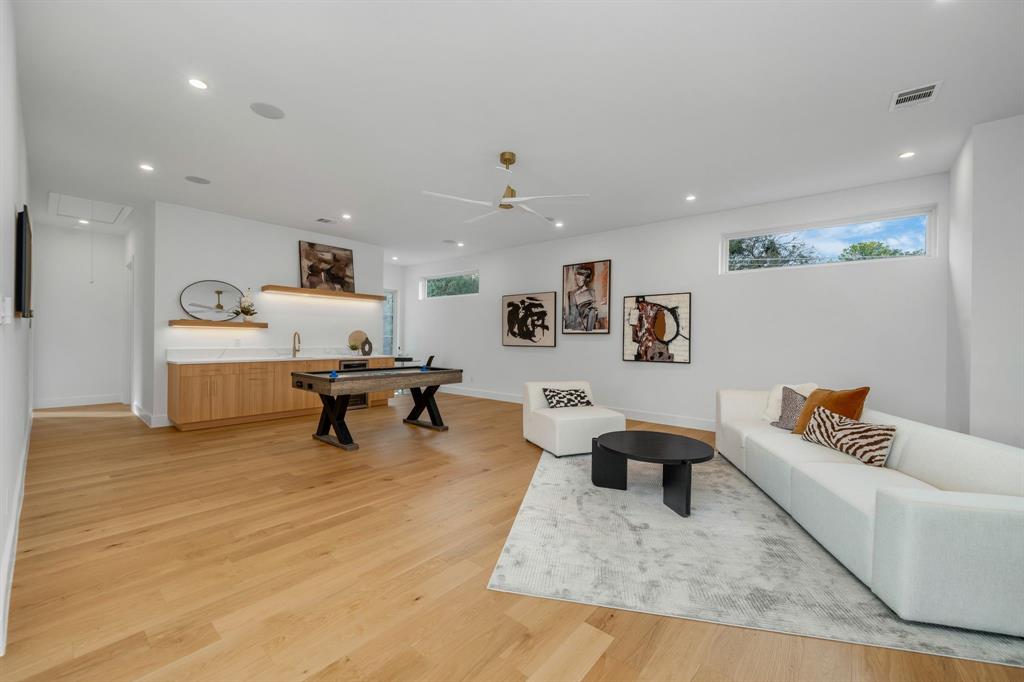 3627 Merrell Road Dallas, TX 75229 - Photo 25 of 39 a living room with furniture and a couch
