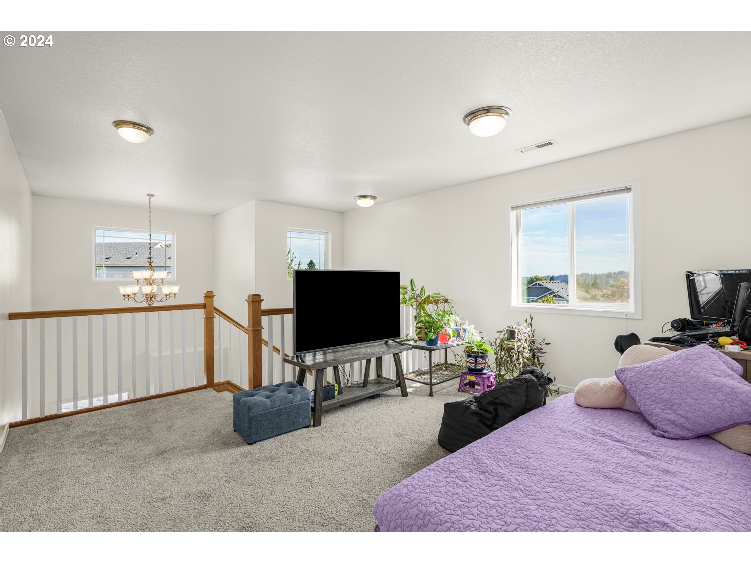 1514 West E Place La Center, WA 98629 - Photo 16 of 26 a bedroom with furniture window and a flat screen tv