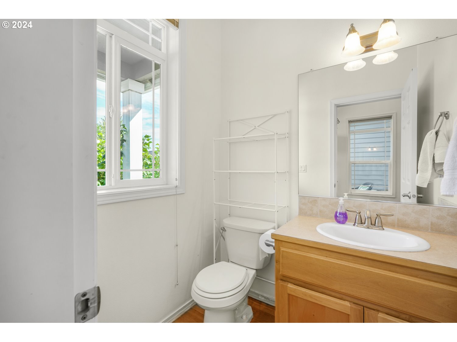 1514 West E Place La Center, WA 98629 - Photo 18 of 26 a bathroom with a sink toilet and a mirror