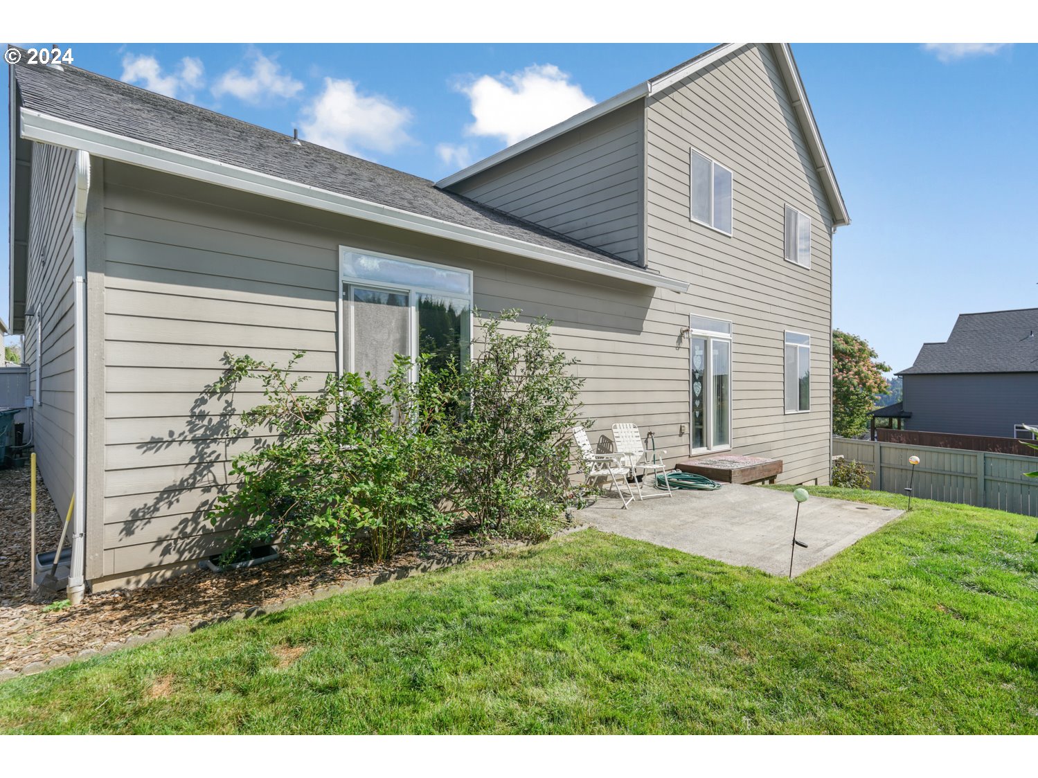 1514 West E Place La Center, WA 98629 - Photo 20 of 26 a view of a backyard with sitting area