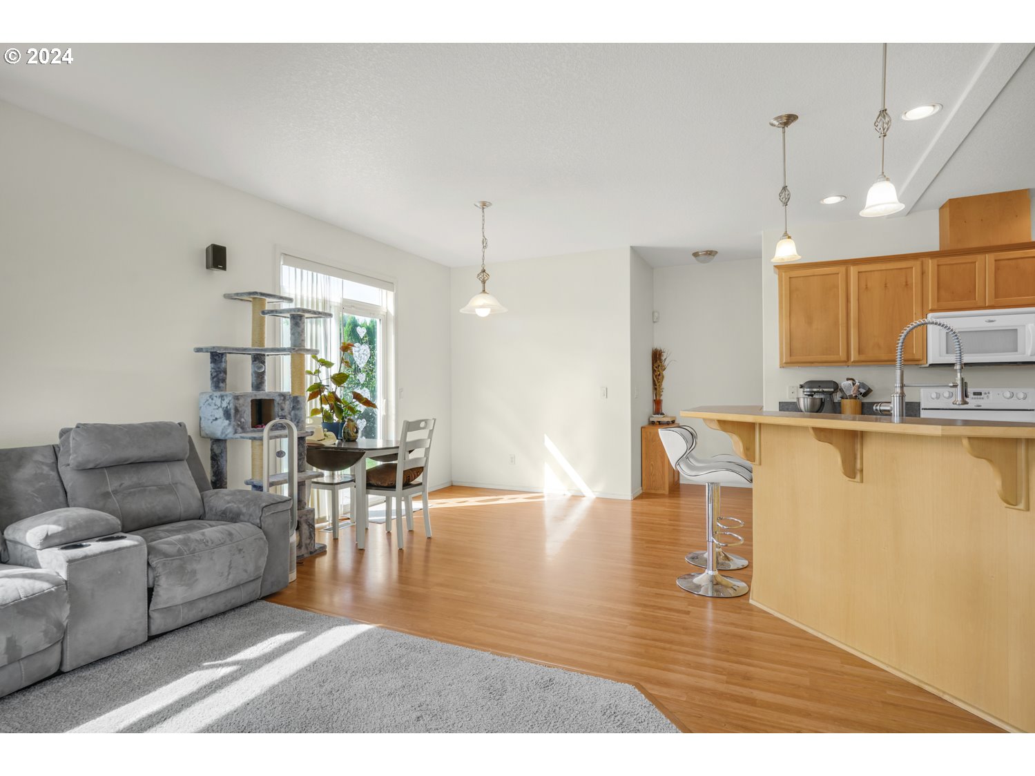 1514 West E Place La Center, WA 98629 - Photo 4 of 26 a living room with furniture and kitchen view