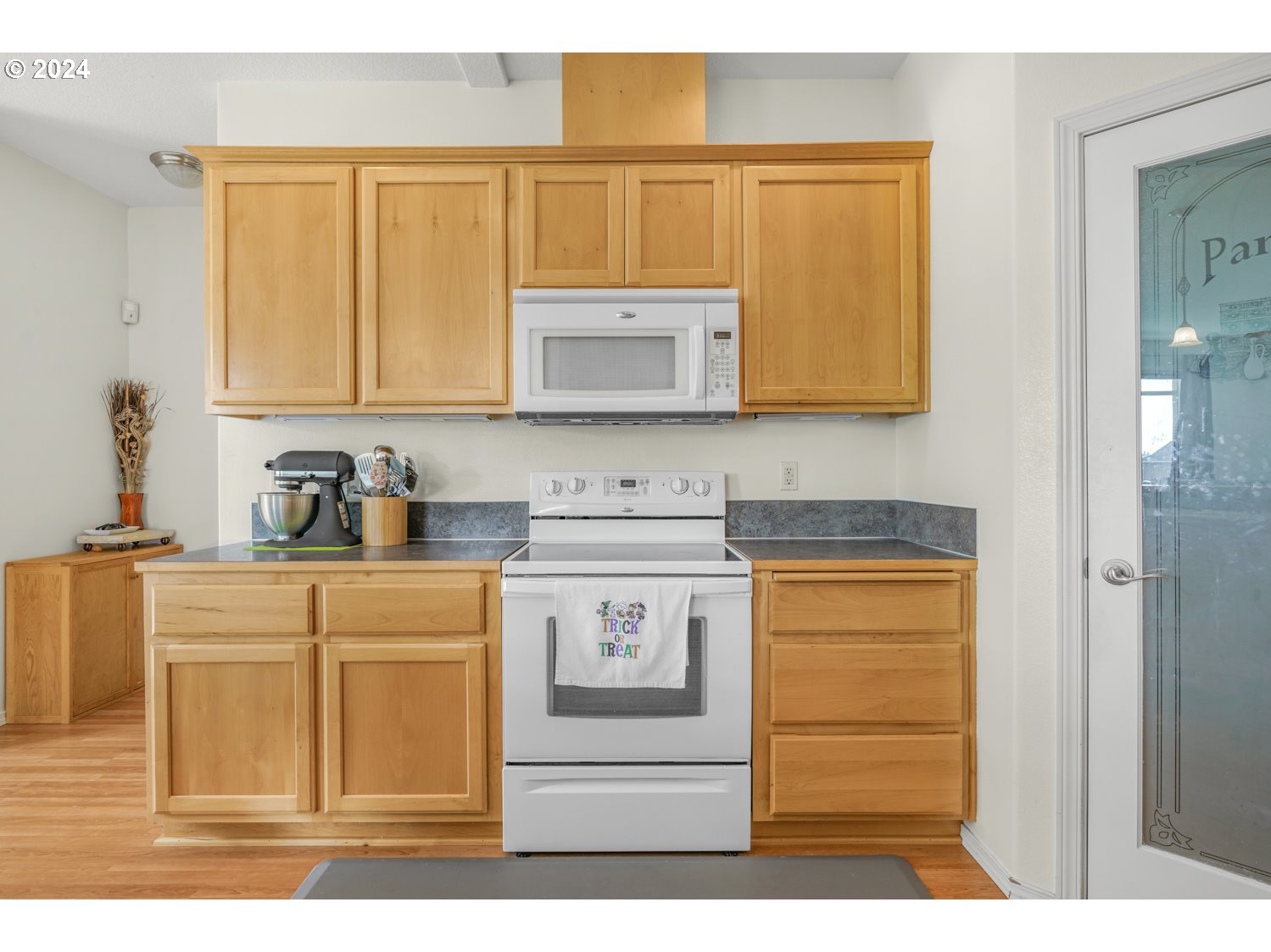 1514 West E Place La Center, WA 98629 - Photo 6 of 26 a kitchen with stainless steel appliances granite countertop a sink stove and cabinets