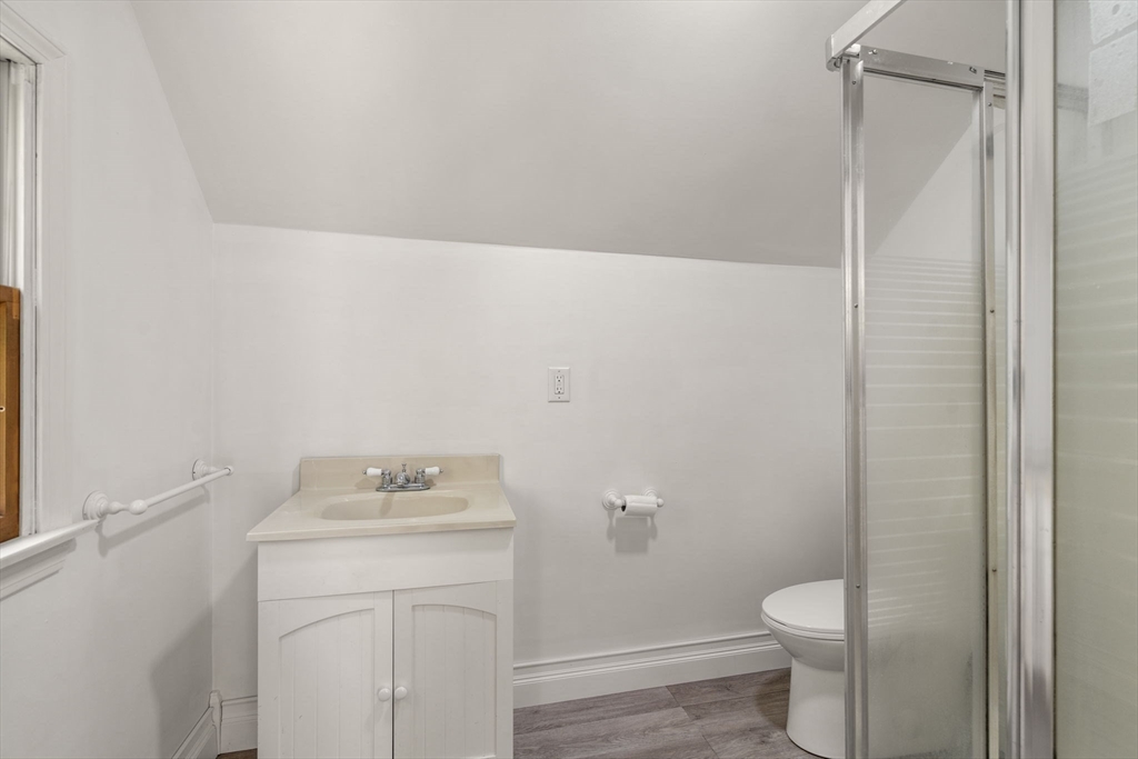405 Harvard Road Bolton, MA 01740 - Photo 27 of 38 a bathroom with a sink toilet and vanity
