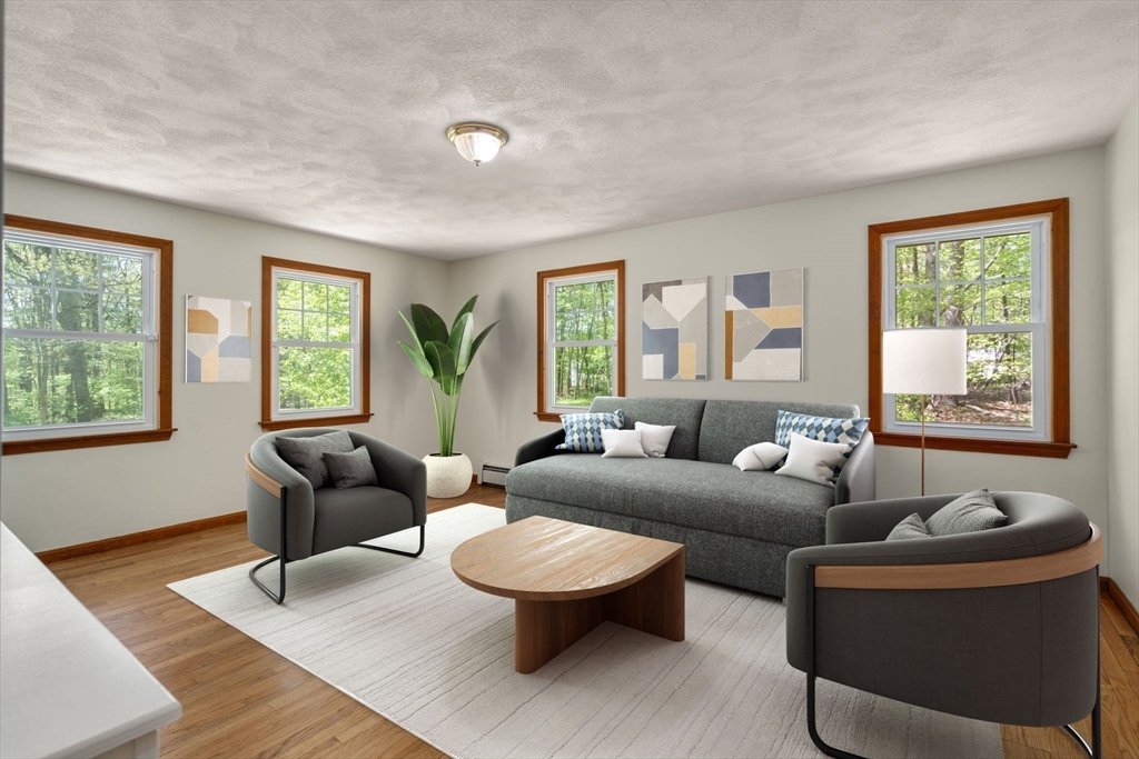 405 Harvard Road Bolton, MA 01740 - Photo 7 of 38 a living room with furniture and a window