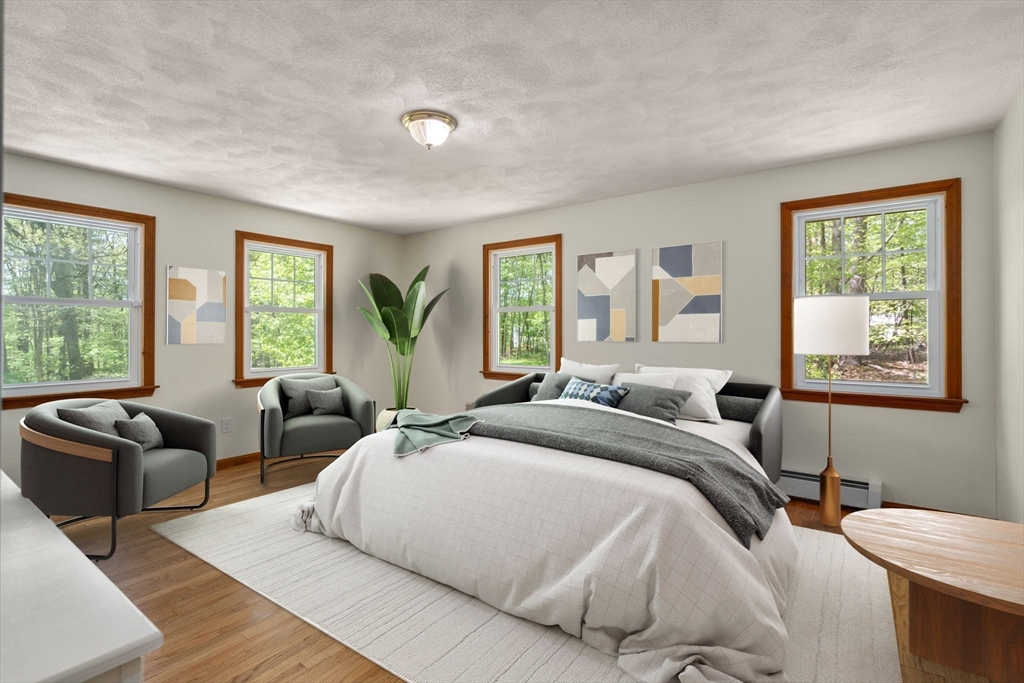 405 Harvard Road Bolton, MA 01740 - Photo 8 of 38 a bedroom with a bed and glass window