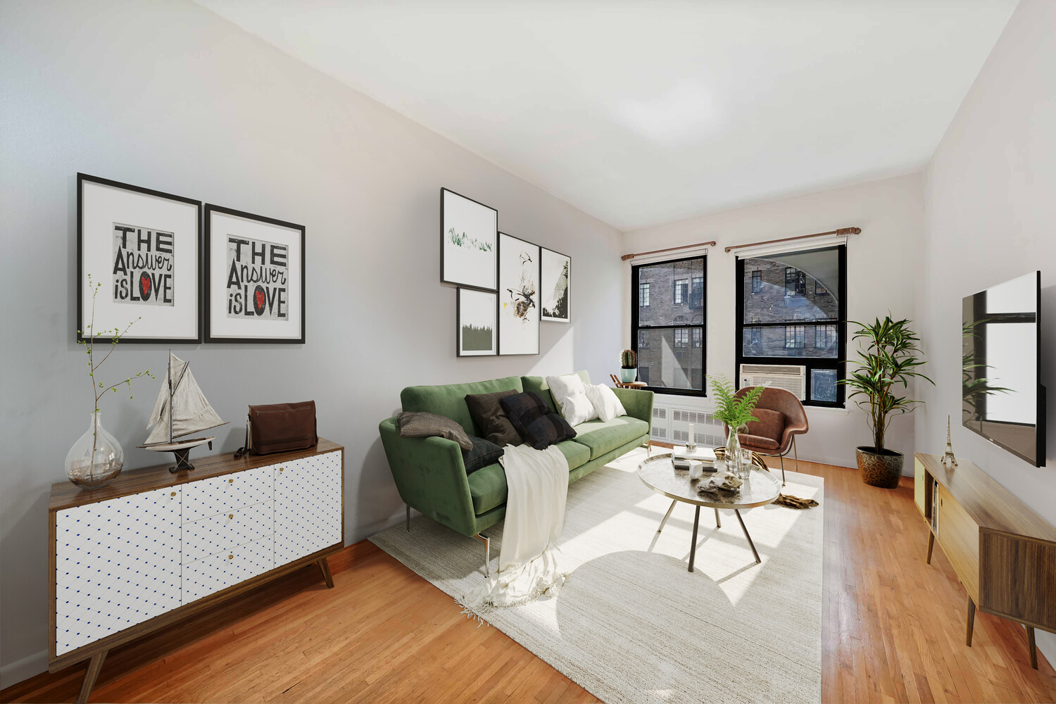 a living room with furniture and a wooden floor