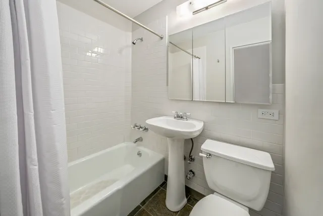 a kitchen with stainless steel appliances granite countertop a stove and a refrigerator
