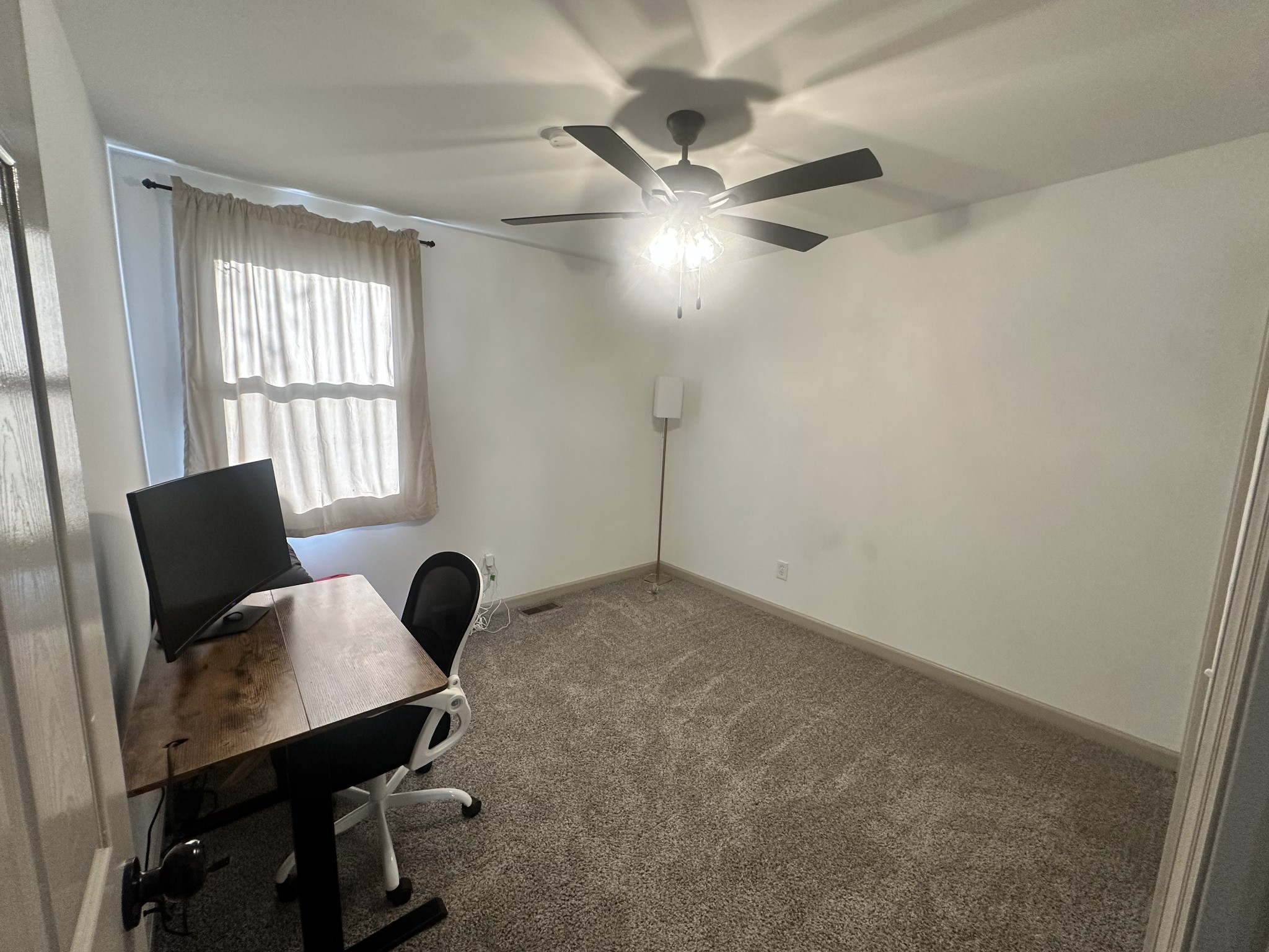 913 Morrow Road Nashville, TN 37209 - Photo 4 of 9 a view of a workspace with furniture and a window