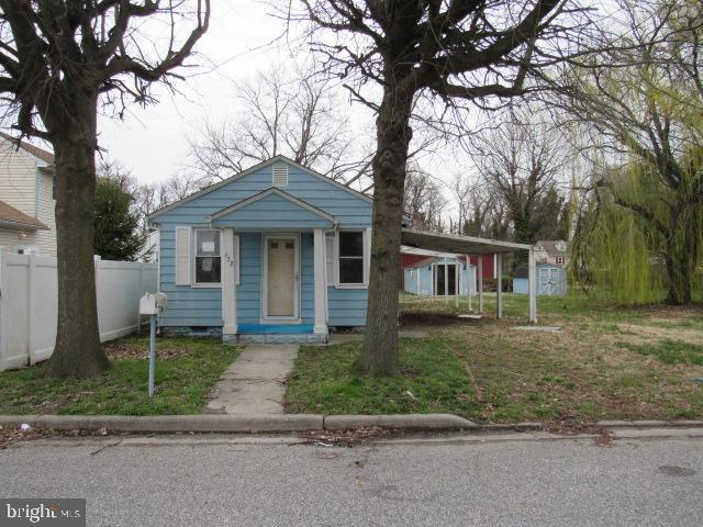 172 Boston Road Pennsville, NJ 08070 - Photo 1 of 9 a front view of a house with a garden and trees