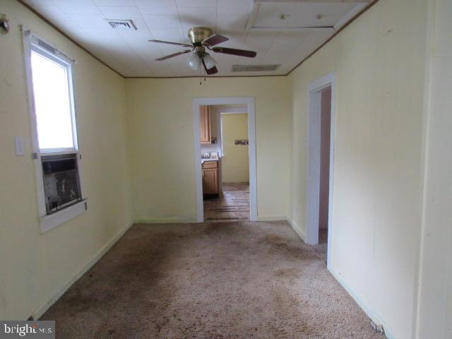 172 Boston Road Pennsville, NJ 08070 - Photo 6 of 9 a view of a livingroom with a ceiling fan and window