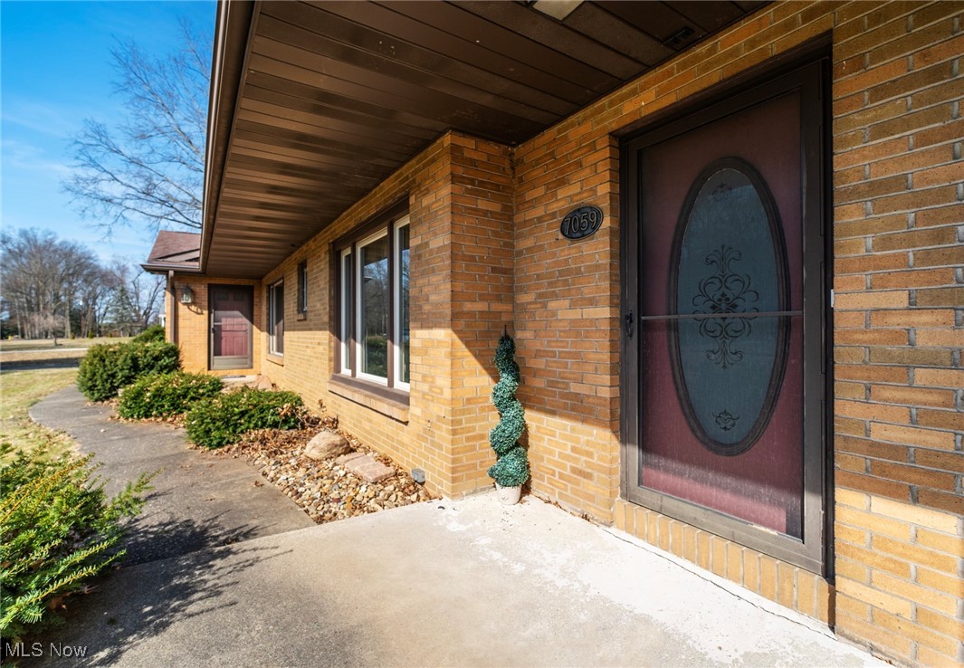 7059 Stewart Sharon Road Hubbard, OH 44425 - Photo 5 of 49 Property entrance featuring brick siding