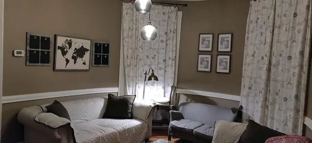 a living room with furniture and walls