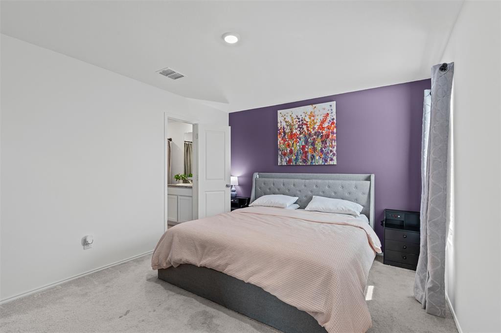 14004 Gaskin Street Pilot Point, TX 76258 - Photo 10 of 31 a bedroom with a large bed and a painting on the wall