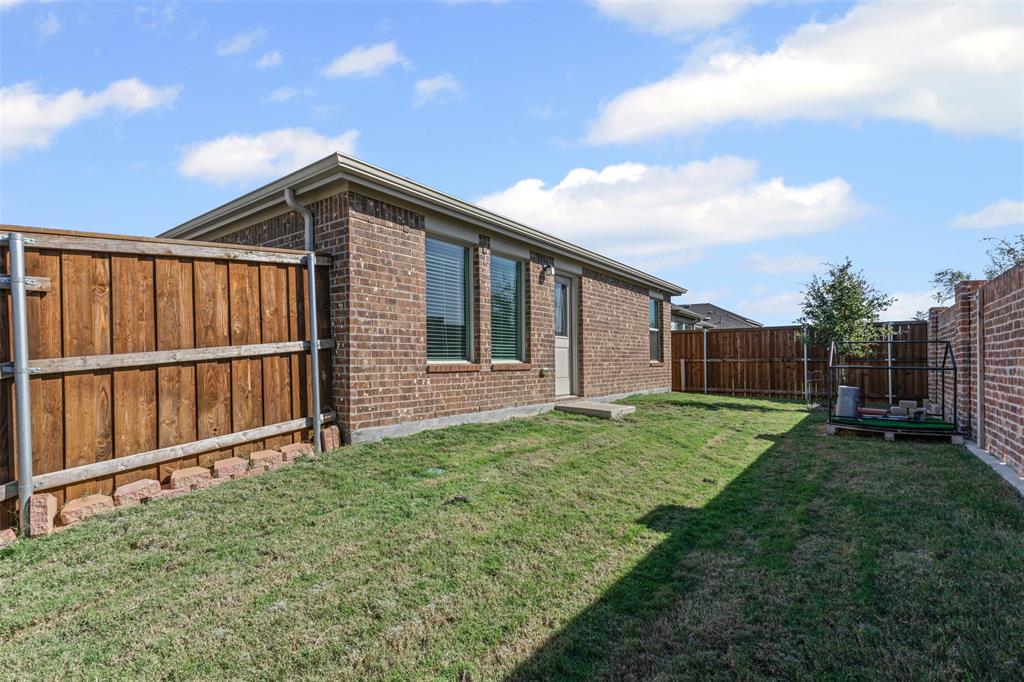 14004 Gaskin Street Pilot Point, TX 76258 - Photo 17 of 31 a backyard of a house with lots of green space