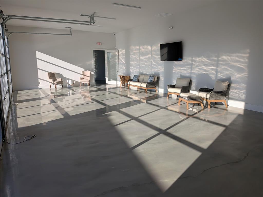 14004 Gaskin Street Pilot Point, TX 76258 - Photo 24 of 31 a living room with furniture and a flat screen tv