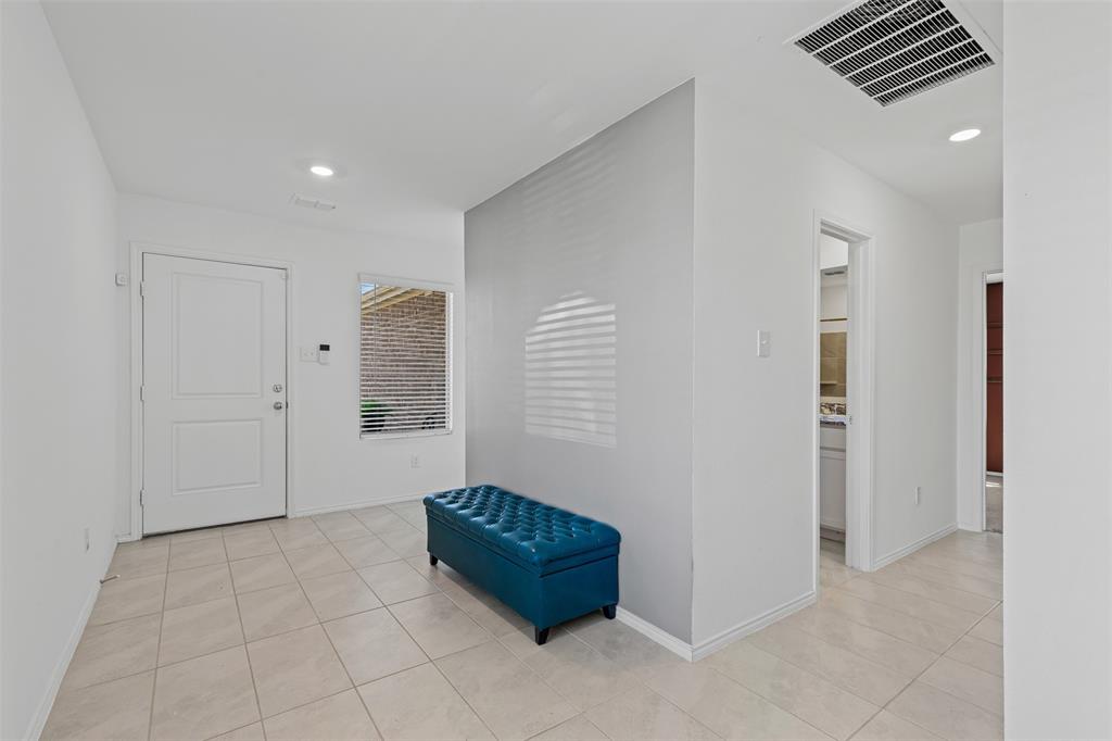 14004 Gaskin Street Pilot Point, TX 76258 - Photo 5 of 31 a spacious bedroom with a bed and a shower