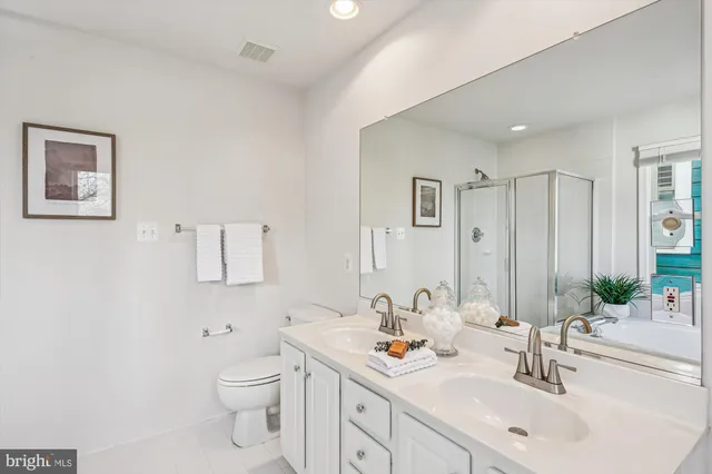 a white bath tub sitting in a bathroom next to a window