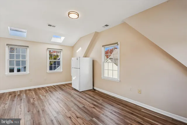 a view of outdoor space with playground and green space