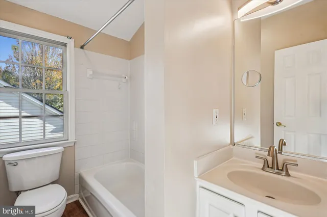 a view of a lake with a house in the background