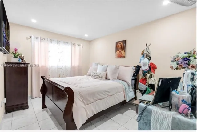 a bed room with a bed and a couch