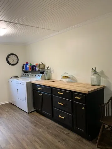 a spacious bathroom with a granite countertop sink and a mirror
