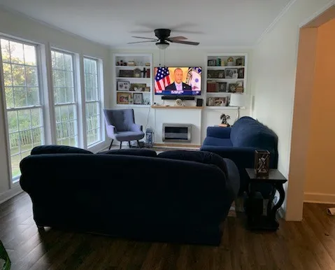 a living room with furniture and a flat screen tv