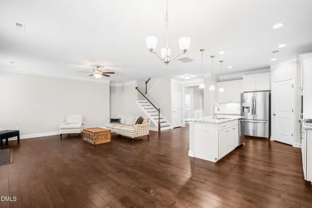 a very nice looking room with kitchen island furniture and a wooden floor