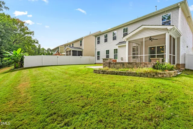 a front view of house with yard and outdoor seating
