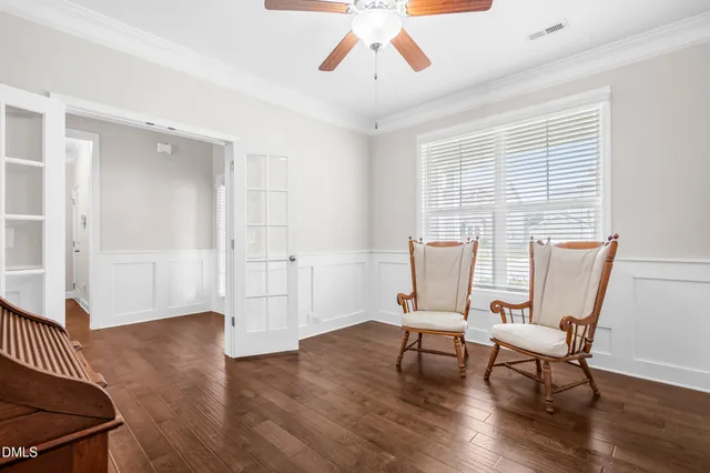 a view of a livingroom with furniture and a window