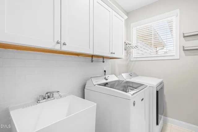 a bathroom with a sink and a window