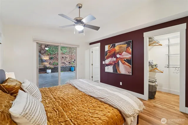 a bedroom with a large bed and a chandelier