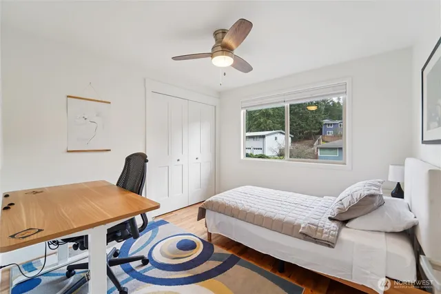 a bedroom with bed and a window