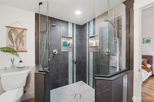 a bathroom with a shower and a toilet