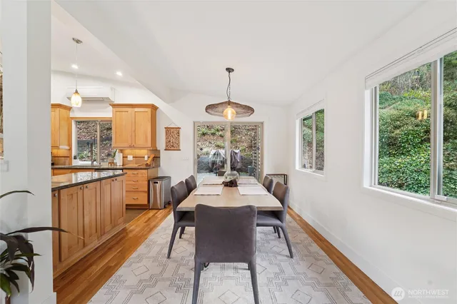 a view of a dining room with furniture window and outside view
