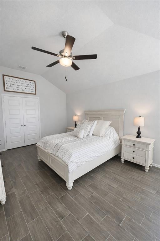 6609 Adderly Road Pilot Point, TX 76258 - Photo 6 of 15 a bedroom with a bed and a chandelier fan