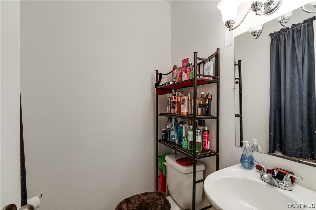 227 Hodder Lane Henrico, VA 23075 - Photo 16 of 24 a bathroom with a sink and a mirror