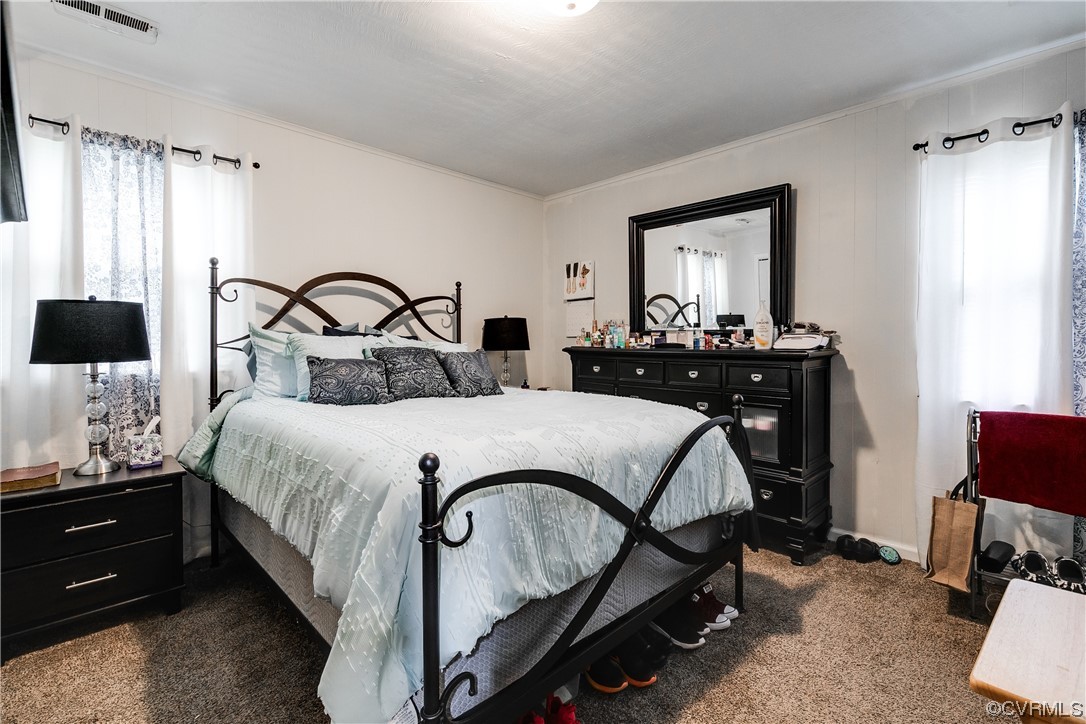 227 Hodder Lane Henrico, VA 23075 - Photo 17 of 24 a bedroom with a bed and wooden floor