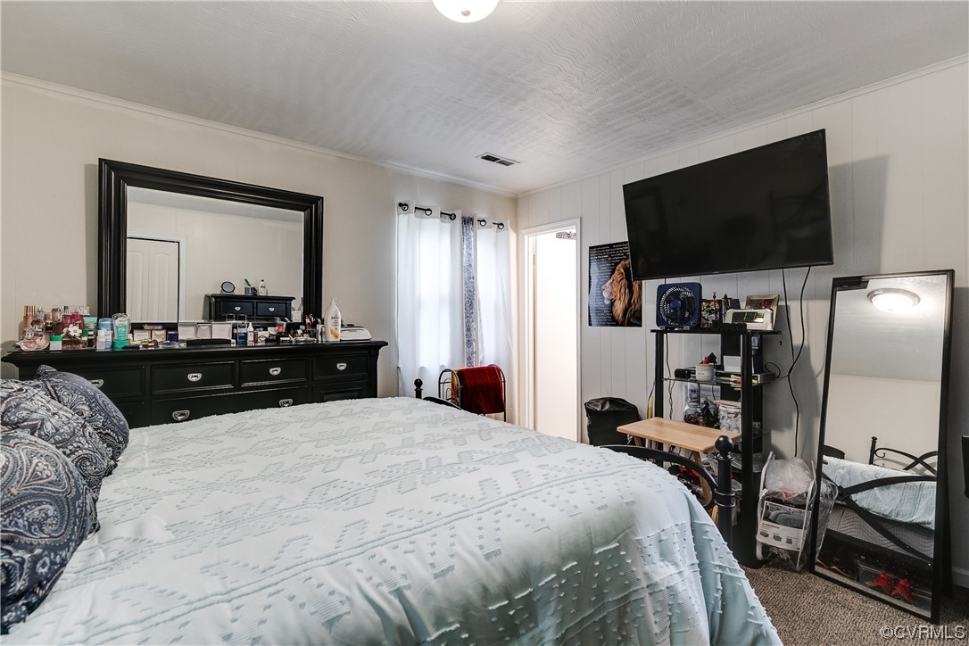 227 Hodder Lane Henrico, VA 23075 - Photo 18 of 24 a bedroom with a bed and a flat screen tv