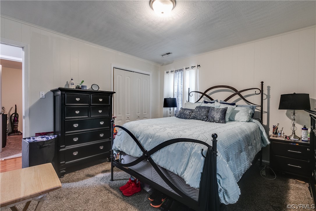 227 Hodder Lane Henrico, VA 23075 - Photo 19 of 24 a bedroom with a bed and a tv on the table