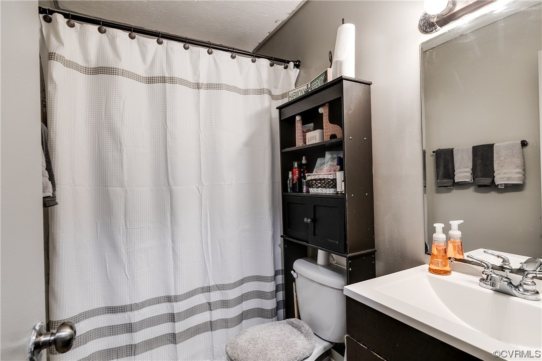 227 Hodder Lane Henrico, VA 23075 - Photo 20 of 24 a bathroom with a sink and a mirror