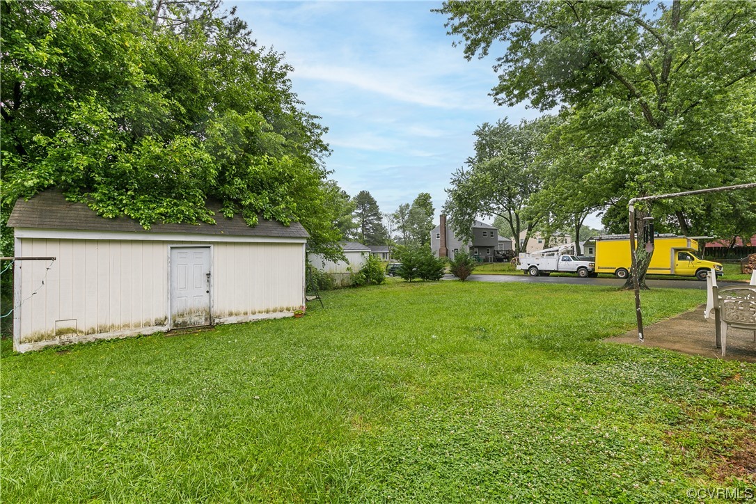 227 Hodder Lane Henrico, VA 23075 - Photo 24 of 24 a view of a backyard with grass and a palm tree