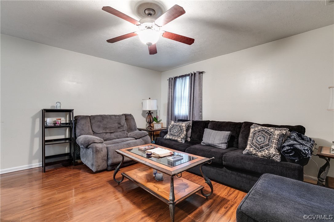 227 Hodder Lane Henrico, VA 23075 - Photo 6 of 24 a living room with furniture a ceiling fan and a rug